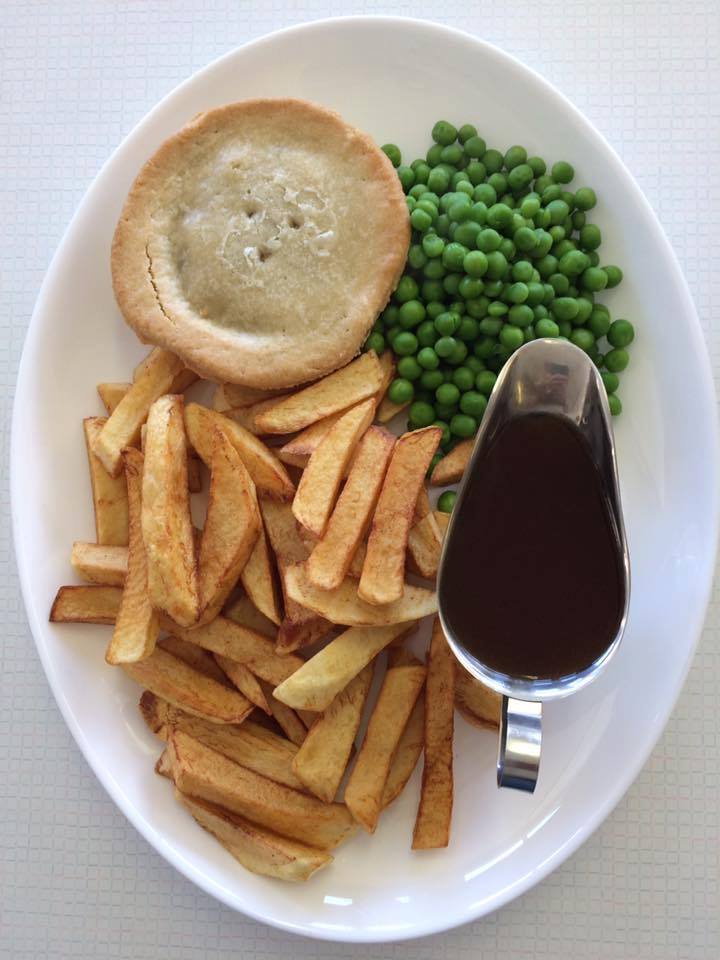 Shirley's Cafe steak and kidney pudding, with chips, peas and gravy
